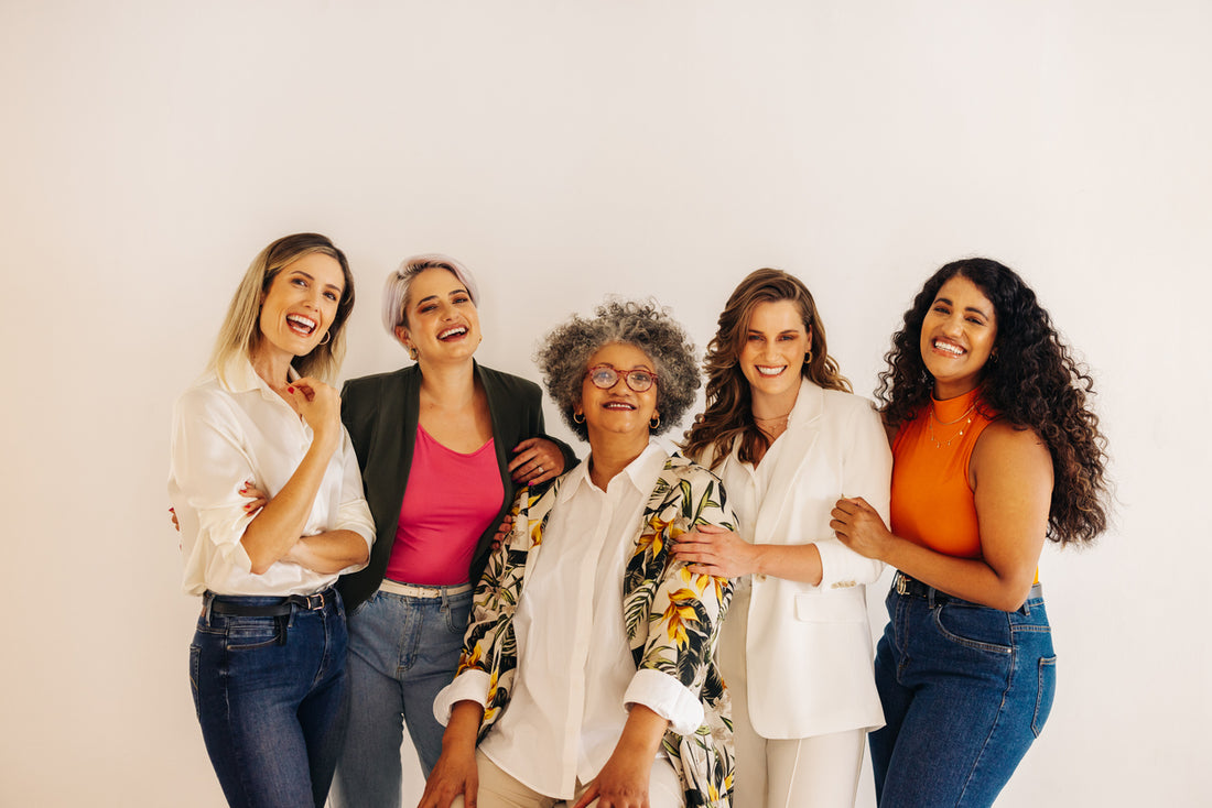 a group of women joined together smiling