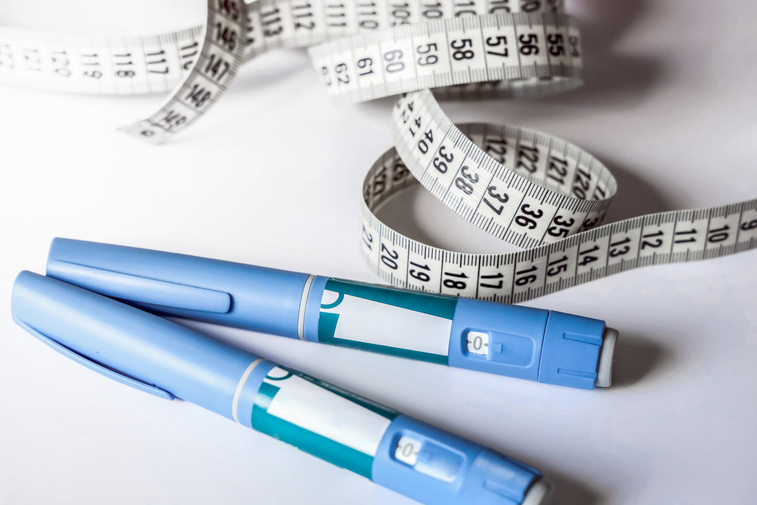 two semaglutide injectables and a tape measure