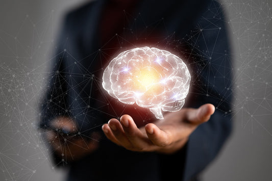 image of a man holding an image of a brain in his hand